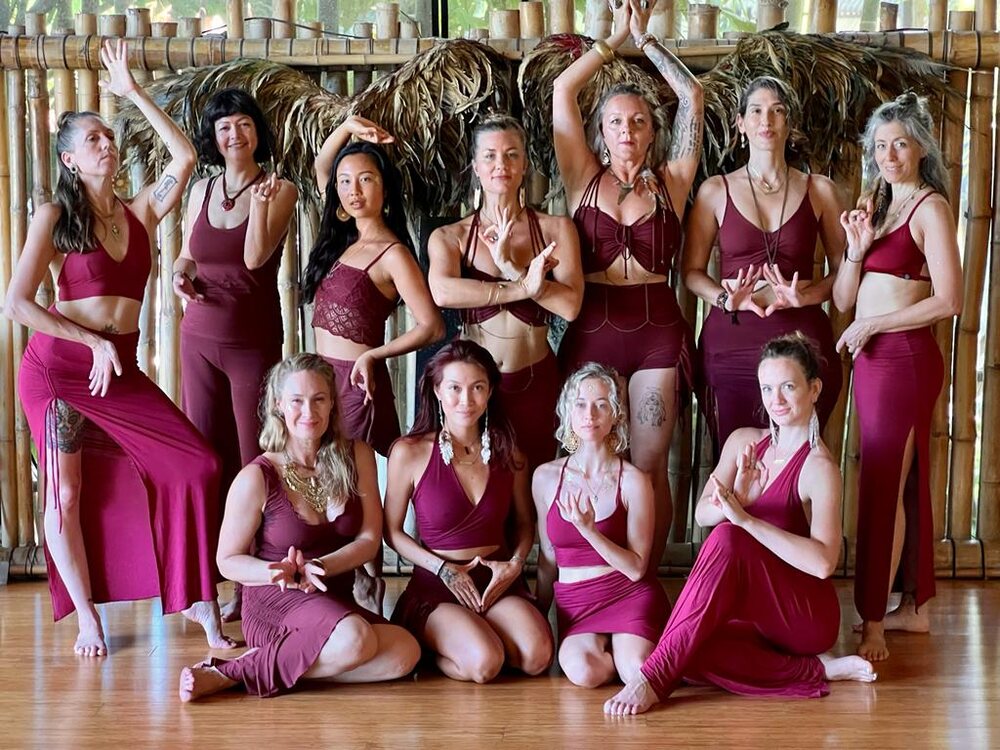 Group of ISHA training graduates in matching outfits